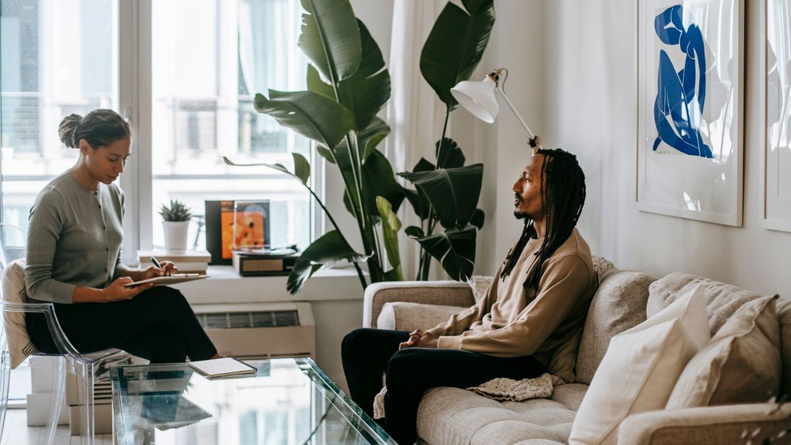 A warm, plant-filled living-room-style therapy space, the kind of calm setting a telehealth session with Lumu Health feels like